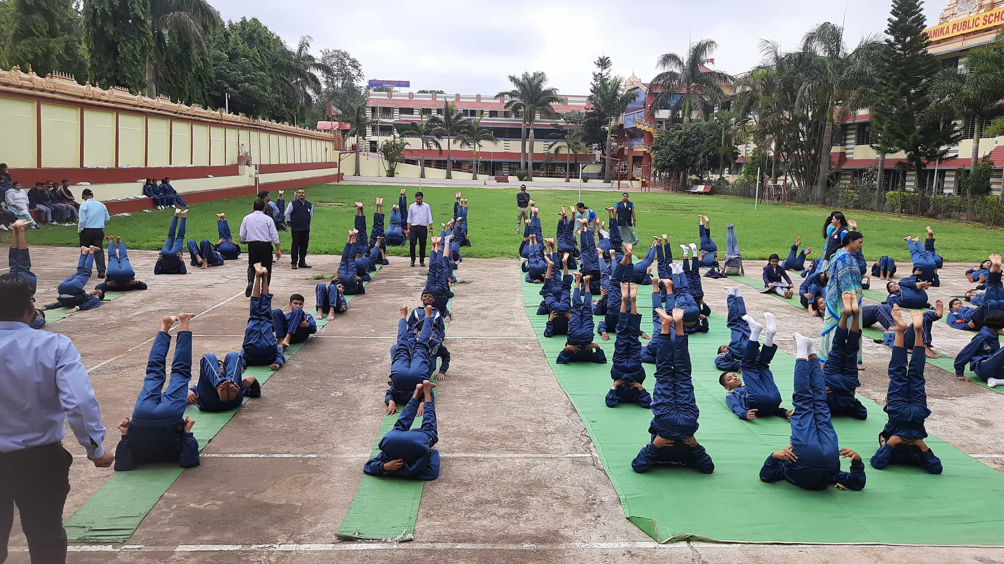 KKSN students practising yoga on the school grounds